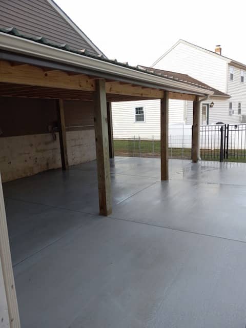 Building an outdoor living space with roof in Lancaster, PA featuring cozy seating, lighting, and weatherproof construction.